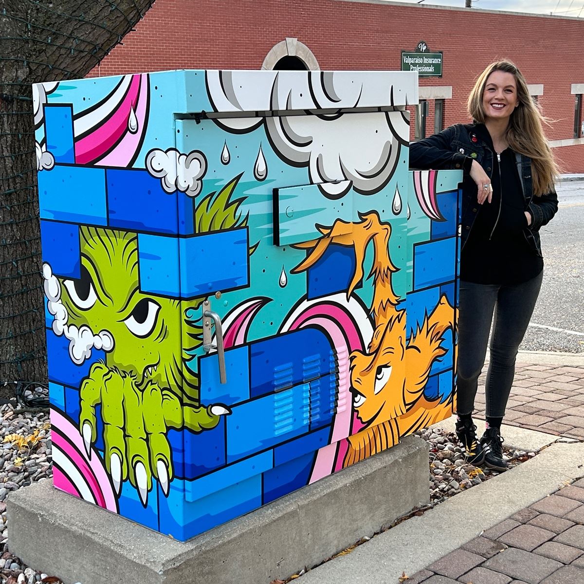 Artist Kat Goodrich with utility box design